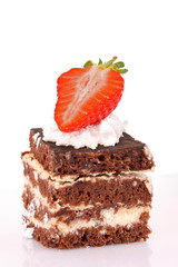 chocolate cake with cream and strawberry on white