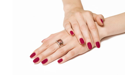 Fototapeta premium Woman hands with pink manicure and zirconium ring