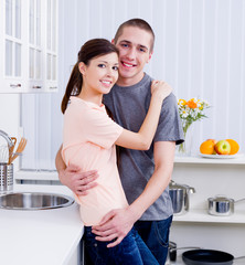 Loving smiling couple in the kitchen