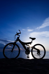 Fototapeta na wymiar Silhouette of a Bike on the Beach