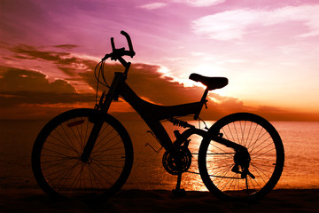 Fototapeta na wymiar Silhouette of a Bike on the Beach