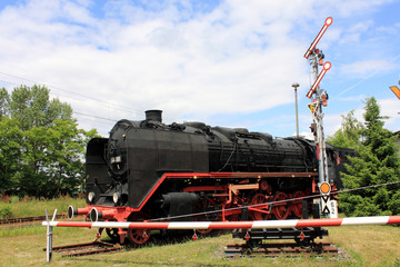 steam engine and railroad signal