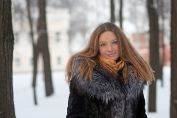 portrait of young woman in winter park