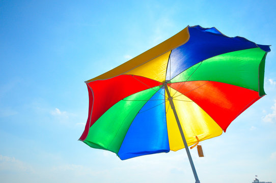 colorful beach umbrella with blue sky
