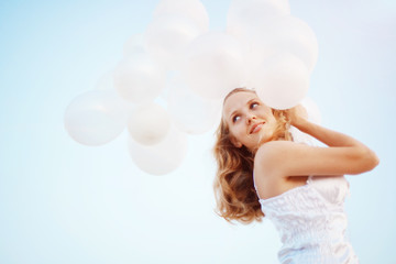 Happy girl with balloons