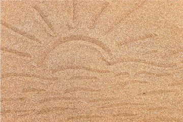 Soleil,plage dessin sur sable.