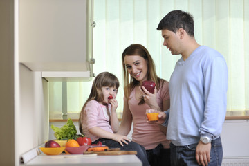 happy young family in kitchen