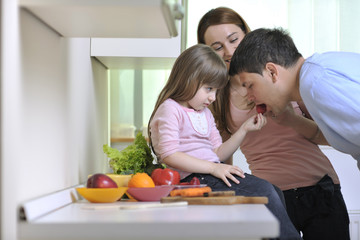 happy young family in kitchen