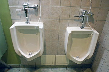Two urinal in man's public washroom.