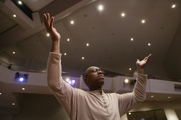 Man Worshipping In Church