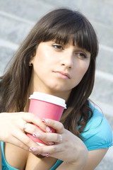 Young woman drinking coffee lunch