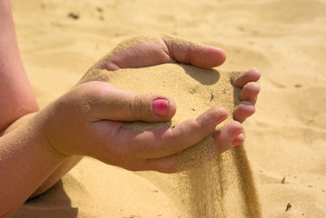 Hands with sand