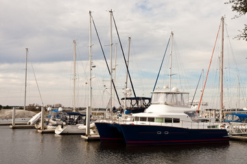 Fototapeta na wymiar Blue Twin Hull Boat at Pier