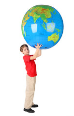 boy in red shirt holding big inflatable globe over his head