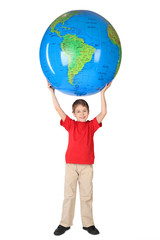 boy in red shirt smiling and holding big inflatable globe