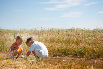 Fototapeta na wymiar two kids playing on rural background