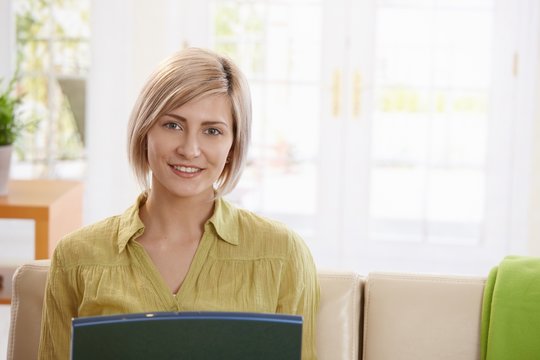 Portrait of woman looking at laptop