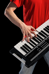 Hands above keys of the piano