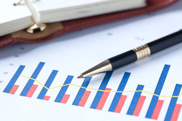 financial graph and pen