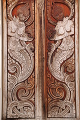 art on door of temple, Wat Nong Sim Noi, Borabue