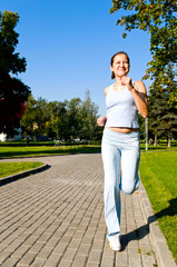 young woman running in the park