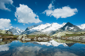 Fototapeta na wymiar Fusshorn (3627m) and Geisshorn(3640m) with small lake.
