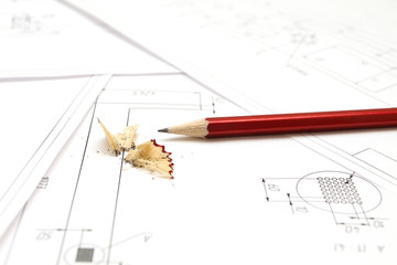 Pencil and blueprints for an architect's design drawings