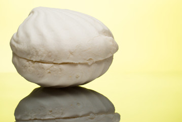 White marshmallow on reflective surface