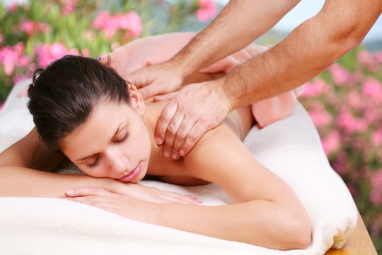 Young woman gets a massage.
