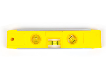 Yellow spirit level isolated on a white background