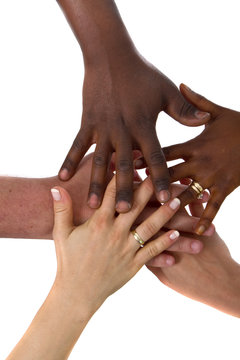 A couple of multiracial hands with different colors over white b