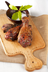 homemade smoked  chicken drumstick on a wood, shallow DOF