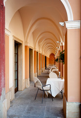 Arched restaurant with cloth covered tables