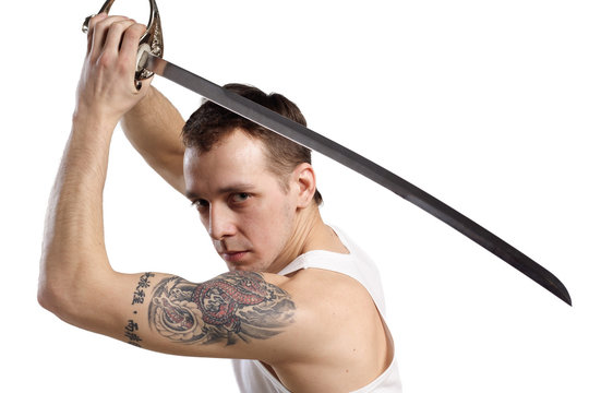 young man with Japanese sword isolated on white background