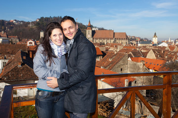 Young couple traveling in Brasov, Romania, Europe. Black Church