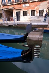 Fototapeta na wymiar Boat and canal in a classic Venetian Scene