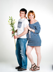 Young beautiful couple expecting a baby