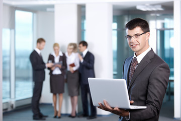Young businessman with laptop