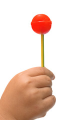 lollipop in the hand of a child