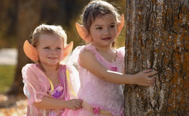 Two Little Elves Waiting In The Autumn Forest