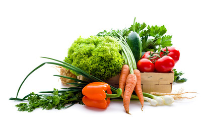 Juicy vegetables in punnet on white background
