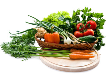 Juicy vegetables in basket on white background