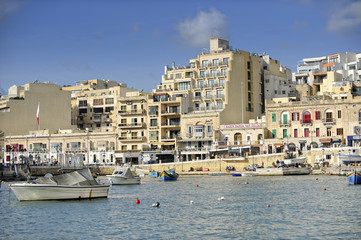 Fototapeta na wymiar Boats docked at St Julians harbour, Valletta, Malta