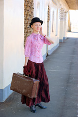 Woman waiting for the train on railway platform