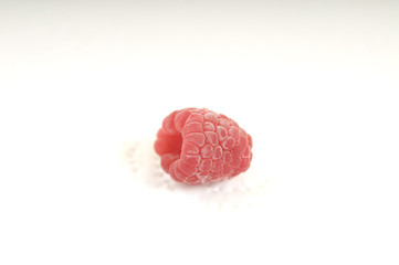 Frozen raspberry fruit on white background