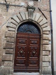 wooden residential doorway  in Tuscany. Italy