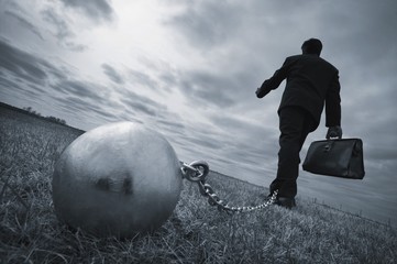 Businessman With Ball And Chain - obrazy, fototapety, plakaty