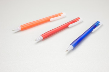 Set of colored pens on table