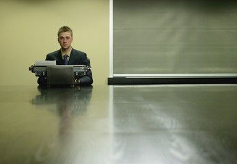 Businessman Using Typewriter