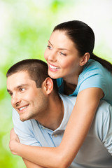 Young happy smiling attractive couple, outdoors